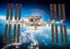 International Space Station with large solar arrays over Earth