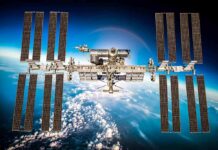International Space Station with large solar arrays over Earth