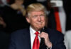 Elite Takeover at War College Donald Trump speaking at a rally with a microphone