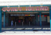 Entrance to Coney Island subway station with people walking