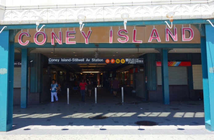 shutterstock_664437622 Entrance to Coney Island subway station with people walking