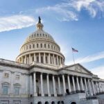 United States Capitol building under a blue sky