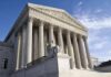 Prosecutor War Erupts Over Floyd Charges Supreme Court building with Corinthian columns