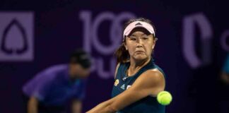 tennis player hitting a backhand shot