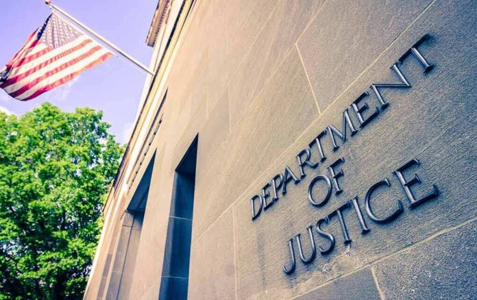 shutterstock_1384089728 Department of Justice building facade with American flag