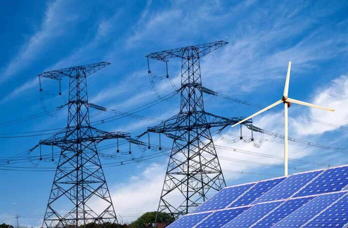 shutterstock_138865700-4 Power lines with wind turbine and solar panels