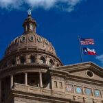 Texas State Capitol dome with U.S. and Texas flags