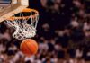 Basketball dropping through a hoop