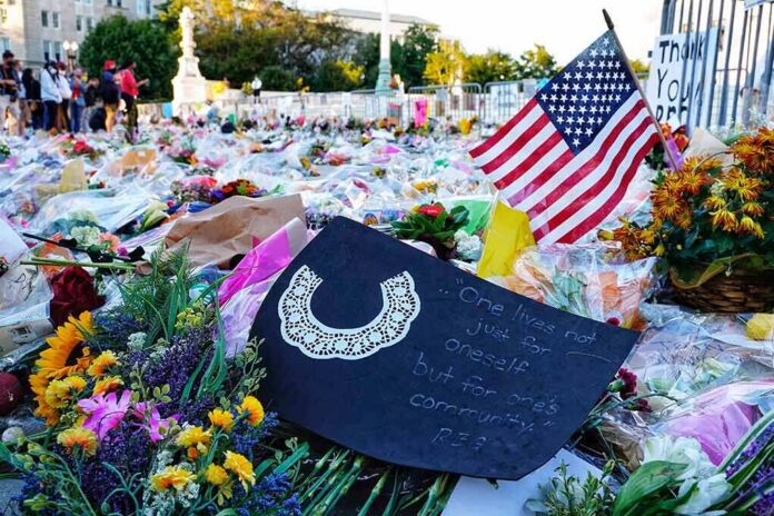 Memorial site with flowers and a U.S. flag