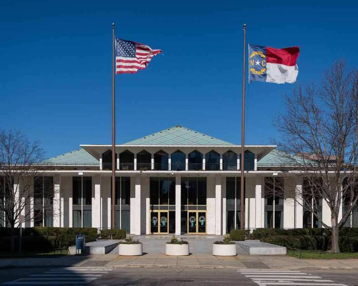 shutterstock_240133126-1 government building with US and state flags at the entrance