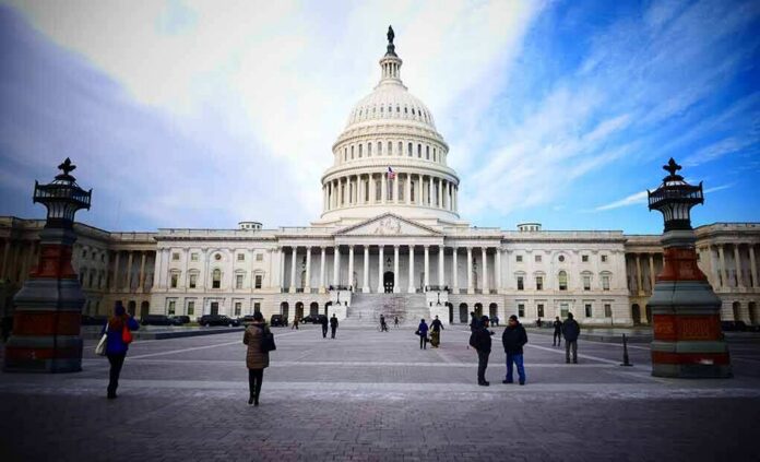 United States Capitol building with visitors on the plaza