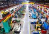 Aerial view of a large industrial workshop filled with various machinery and equipment