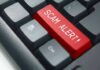 Keyboard with red scam alert key