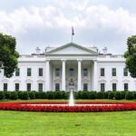 Free Press Showdown Erupts at White House The White House with fountain and red flower bed