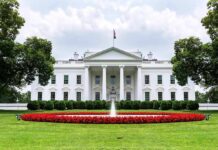 Free Press Showdown Erupts at White House The White House with fountain and red flower bed