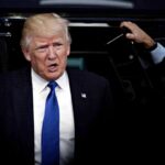 Labor Day Brawl: Trump Goes Nuclear man in suit stepping out of a vehicle