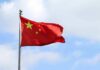 Chinese national flag waving on a flagpole
