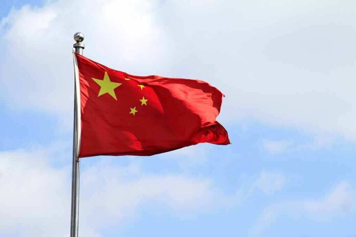 Chinese national flag waving on a flagpole