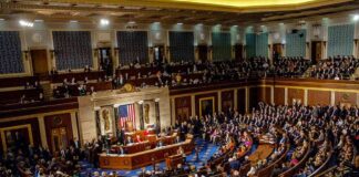 Legislative chamber filled with lawmakers during a formal session