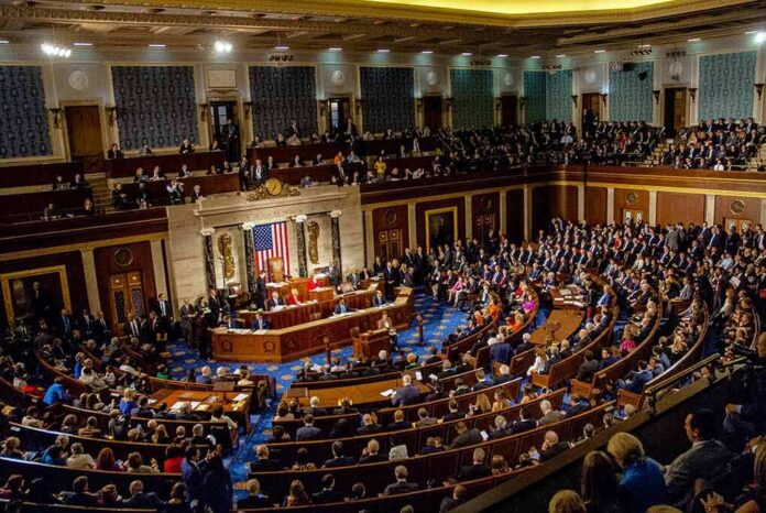 Legislative chamber filled with lawmakers during a formal session
