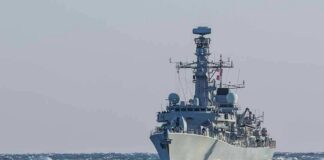 naval warship sailing on rough sea