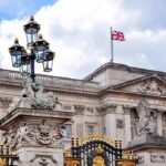 Memoir Grenade Rattles Buckingham Palace Buckingham Palace facade with Union Jack flag and ornate gate