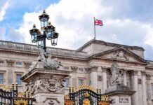 Memoir Grenade Rattles Buckingham Palace Buckingham Palace facade with Union Jack flag and ornate gate