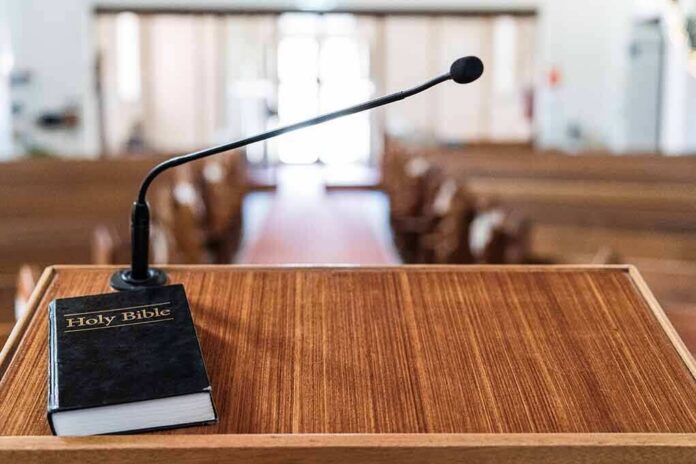 shutterstock_1271187499-5 Podium with microphone and Bible in a church