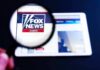 Magnifying glass over Fox News website logo on a tablet
