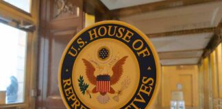 U.S. House of Representatives seal on a glass door