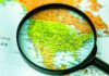 AI Annexation Maps Ignite Uproar Magnifying glass focusing on a map of the United States