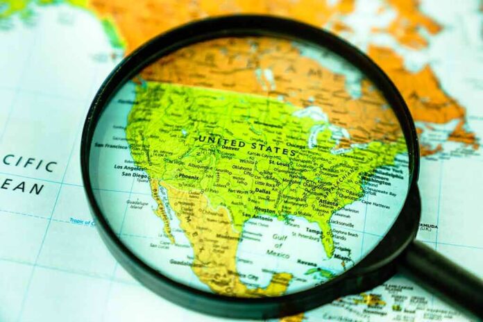 shutterstock_1635435619 Magnifying glass focusing on a map of the United States