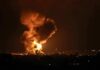Large explosion with fireball and smoke at night
