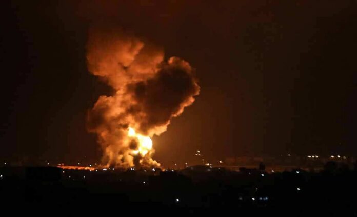 shutterstock_1971862577 Large explosion with fireball and smoke at night