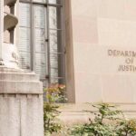 Department of Justice building facade with stone sign and window