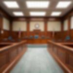 Empty courtroom with wooden benches and judge's bench