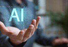 Hand holding glowing AI hologram