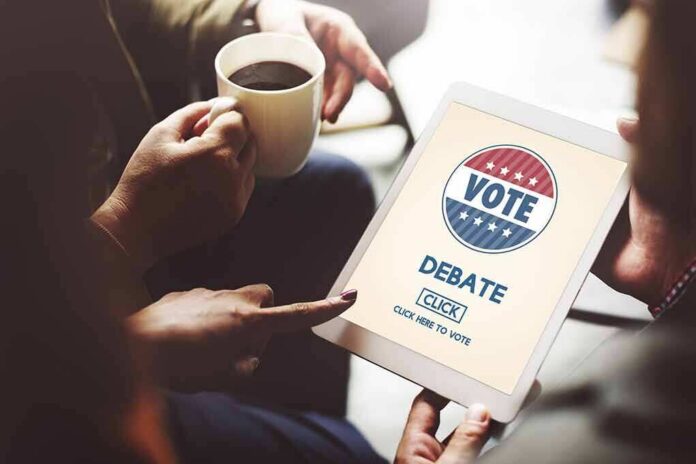 Hands holding a tablet with a voting screen and a person holding coffee