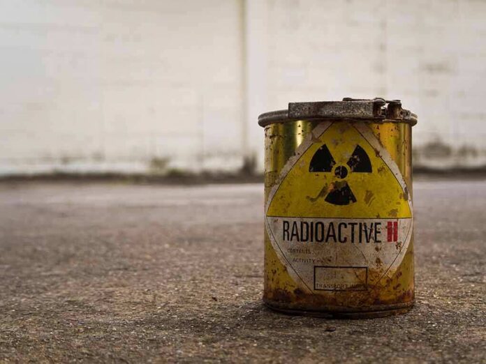 rusty metal can with radioactive warning symbol