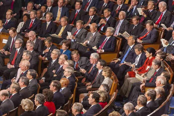 Rick Santorum, Samuel Bodman, Bob Bennett, La Parka, Mike Leavitt, Trent Lott, Saxby Chambliss, Richard Shelby, Spencer Abraham, Gordon H. Smith, Stephen Hadley, Richard M. Burr, Pat Roberts, John Cornyn, Joshua Bolten, Wayne Allard, Jerzy Eisler, Alphonso Jackson, John Warner, Mel Martinez, Olympia Snowe, David Vitter, Lindsey Graham, Johnny Isakson, Judd Gregg, John McCain, Andrew Card, Susan Collins, George Allen, Lincoln Chafee, Norm Coleman, Lamar Alexander, Richard Lugar seated in a large audience