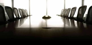 empty conference room with long table and chairs