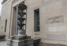 Department of Justice building exterior with sculptural fountain