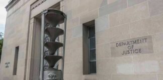 Department of Justice building exterior with sculptural fountain