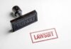 Porch-Theft Guess Triggers Massive Lawsuit Rubber stamp with red lawsuit imprint on white paper