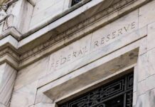 Federal Reserve Holds Rates Amid Inflation Uncertainty Federal Reserve building facade in white marble