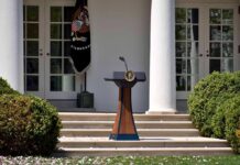 Podium with presidential seal in a garden colonnade
