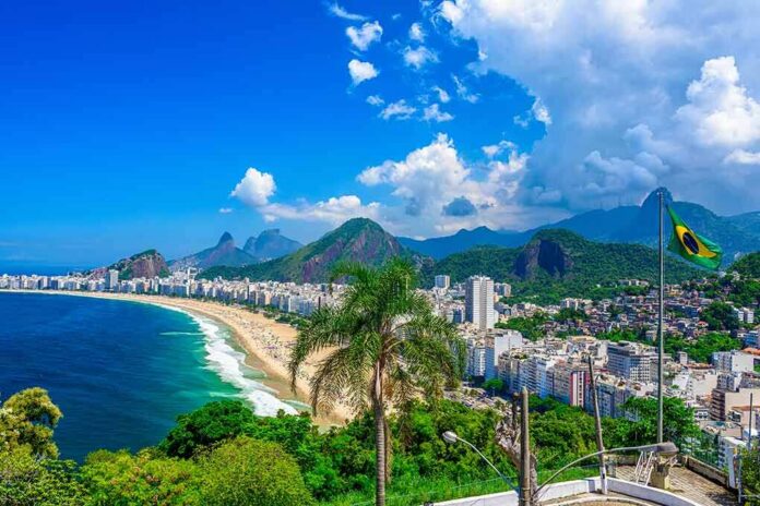 Copacabana Beach coastline with city skyline and mountains