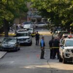 Austin Block Locked Down Over ‘Antique’ Grenades Police officers secure a residential street with patrol cars and yellow tape