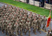 Testosterone Crisis Looms Over Army Soldiers in camouflage uniforms march in formation on a street