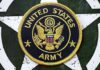 United States Army embroidered patch on a green star background